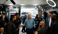 President Biden greets staff and patrons at Regal Lounge, a Men's Barber & Spa, in Columbia, S.C., before speaking at a political event in the area on Jan. 27.