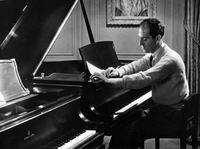 George Gershwin, photographed in his 72nd Street apartment in New York in 1934. His <em>Rhapsody in Blue</em> premiered 100 years ago on Feb. 12, 1924.