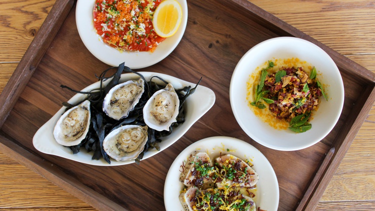 Chef Brian Dunsmoor shops for ingredients for his albacore crudo — a small plate that is emerging as his restaurant’s signature dish.